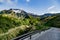 Scenic view on abandoned buddhist temple, mountains and road to mountain Aso