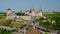 Scenic view of the ancient Kamianets Podilskyi Castle by field against sky.