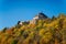 Scenic view of ancient ruins of gothic and renaissance medieval royal castle, autumn landscape, sunny day, fortresses on hill,