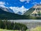 The scenic view of the Athabasca River and surrounding mountains in Jasper National Park in Canada