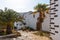 Scenic view of the back of the white church of Betancuria surrounded by palms, Fuerteventura, Spain