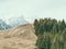 Scenic view from Baiului Mountains with the snowy peaks of Bucegi Mountains.