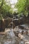 scenic view of beautiful Kanto Lampo Waterfall, green plants and rocks,