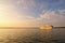 Scenic view of beautiful large white ship. Panoramic dramatic sunset sky. Ship glides out of the port of Koper