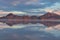 Scenic view of beautiful mountains reflecting in lake of Bonneville Salt Flats at sunrise, Wendover, Western Utah, USA, America.