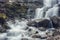 Scenic view of the beautiful Shypit waterfall in the Carpathian mountains, winter landscape