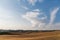 scenic view of beautiful Tuscany fields with clouds on blue