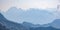 Scenic view of blue ridge in hazy mountains. Julian Alps