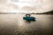 scenic view of bright blue motorboat on the water