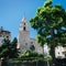 Scenic view of Church of Our Lady of Accoules (Notre Dame des Accoules) among fresh green trees, located in Daviel Square in