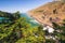 Scenic view of cliffs and Pacific ocean, framed by Cypress trees. Big Sur, CA