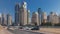 Scenic view of Dubai Marina Skyscrapers with cars timelapse, Skyline, View from sea, United Arab Emirates