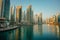 Scenic view of Dubai Marina, UAE, with serene waters and towering cityscape