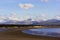 Scenic view eastwards across Llanddwyn Beach towards the Snowdonia Mountain range, Anglesey, North Wales