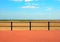 Scenic view from the end of the promenade at saint annes on the sea in lancashire with railings in front of the sandy beach with g