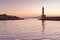 Scenic view of the entrance to Chania harbor with lighthouse at sunset, Crete