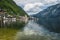 Scenic view of famous Hallstatt lakeside town reflecting in Hallstattersee lake in the Austrian Alps. Salzkammergut