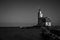 Scenic view of the famous Paard van Marken lighthouse in the Netherlands in grayscale