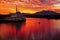 Scenic view of floating mosque on river with sunset background