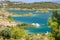 Scenic view at the Gadoura water reservoir on Rhodes island, Greece with blue and turquoise water and green landscape around the
