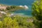 Scenic view at the Gadoura water reservoir on Rhodes island, Greece with blue and turquoise water and green landscape around the