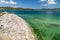 Scenic view at the Gadoura water reservoir on Rhodes island, Greece with stonyl shore, blue and turquoise water