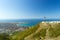 Scenic view of Gelendzhik resort city from hill of caucasian mountains. Worship cross monument with orthodox chapel in