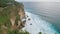 Scenic view of high cliff and deep blue sea at the foot of the rock. Breathtaking panoramic scene of high mountain view