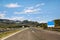 Scenic view on highway road leading through in Croatia, Europe / Electrical transmission towers, sky and clouds in background.