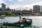 Scenic view from historic Hyde Street Pier of San Francisco Maritime National Historical Park toward busy Aquatic Park Cove beach