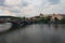 Scenic view of historical center of Prague, Manes Bridge and Vltava river at cloudy summer day. Buildings, cathedrals and landmark