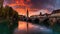 Scenic view Historical Old Town with colorful sky, view on bridge over river and church tower during dramatic sunset.Generative ai