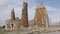 Scenic view of historical remains of two stone towers of Hellenistic gate and colonnaded street of empty ancient city of