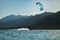 Scenic view of a kitesurfer gliding on the lagoon's water