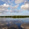 Scenic view of lake against blue sky