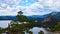 scenic view of lake and mountains overgrown with forest