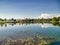 Scenic view of lake by trees against sky