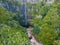 Scenic view of Levada 25 waterfalls surrounded by lush greenery. Madeira, Portugal