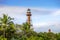 Scenic view of lighthouse on Sanibel Island with blue sky and puffy white clouds