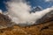 Scenic view of Machapuchare Fish Tail surrounded by clouds and path to Annapurna Base Camp, Himalayas