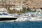 Scenic view of many luxury sailing fishing boat and charter rental speedboats moored at mountain harbor lake bay against