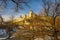 Scenic view of medieval fortress of Kamianets-Podilskyi, Ukraine from Smotrych Canyon through the branches of bare trees