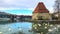 Scenic view of medieval Water tower, Old State bridge and Swans on the Drava river, Maribor, Slovenia, 4k footage video