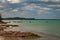 Scenic view of the MIches bay in the Dominican Republic; green sea, boats, clouds