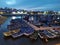 Scenic view of moored wooden boats in the fishing port in Setubal, Portugal at night