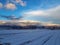 Scenic view of mountains covered in clouds lit by sunlight