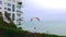 Scenic view of a no engine paraglider flying a very low altitude in Barranco district of Lima