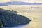 Scenic view of the ocean and shoreline at sunset in Maple Bay, Vancouver Island, BC