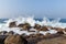 scenic view of ocean waves washing into rocks, sri
