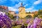 Scenic view of Old Town Hall of Bamberg Altes Rathaus with two bridges over the Regnitz river flower view